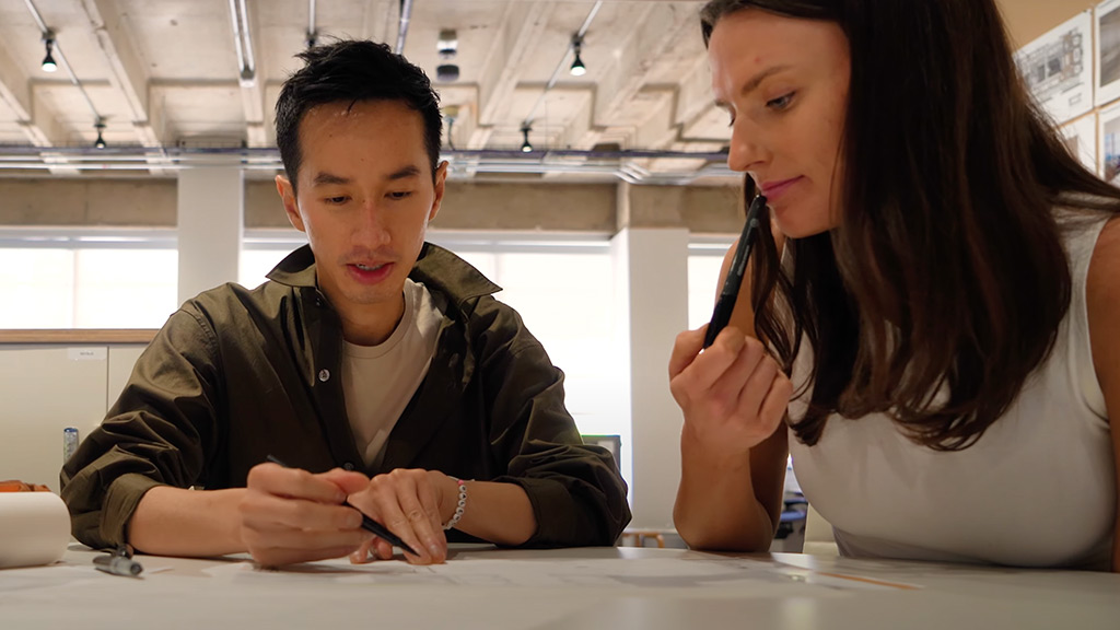 Gensler Dallas Design Director Khoi Hoang showing sketches to designer