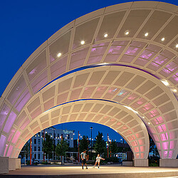 A large circular building with a curved roof.