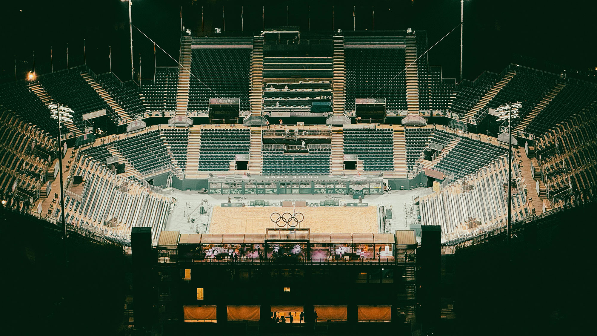 A large stadium with a crowd of people in it.