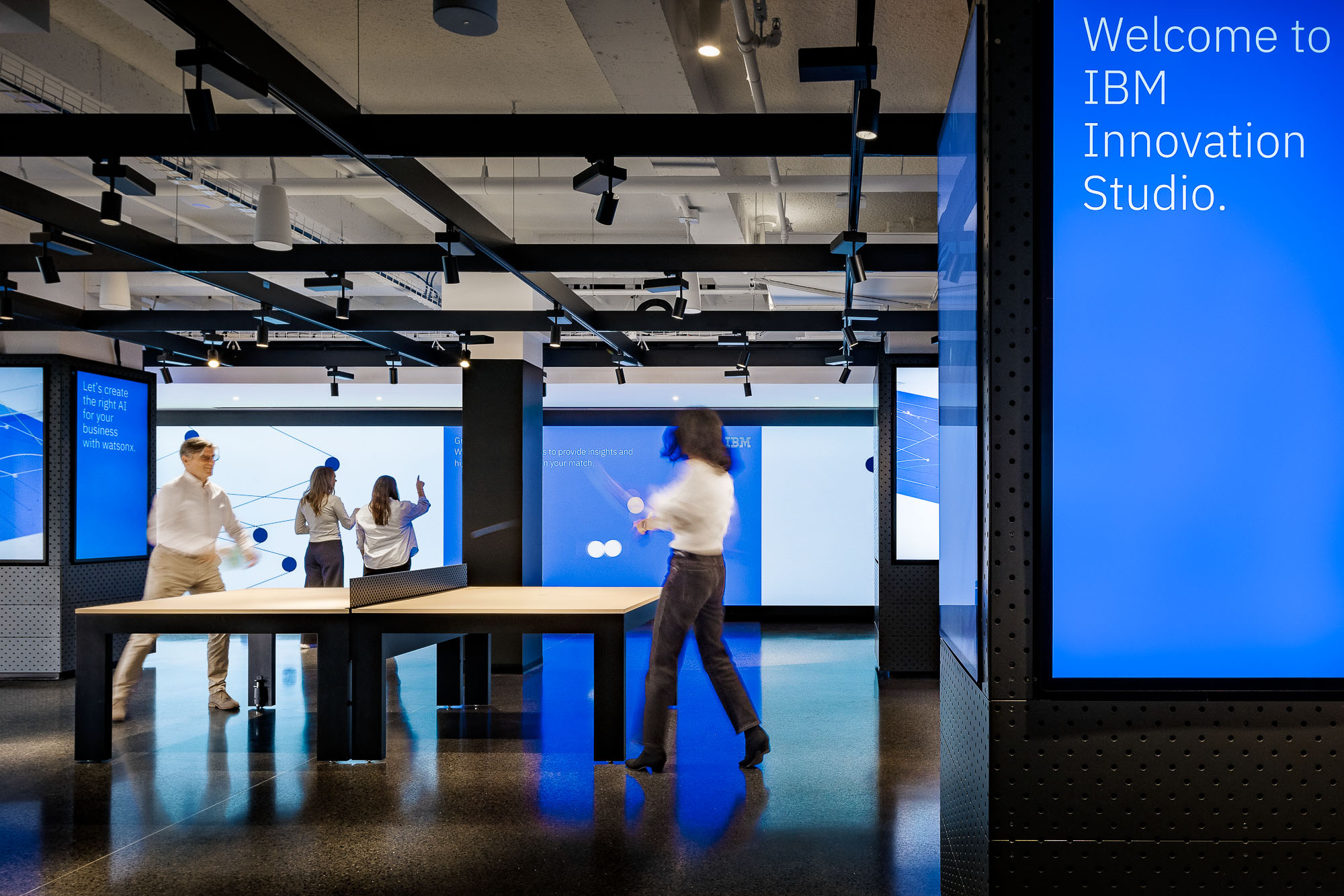 IBM flagship innovation studio with digital screens and ping pong table