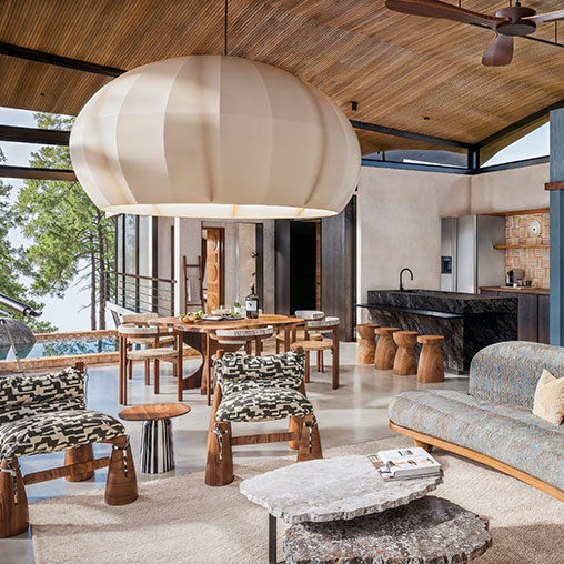 Origins Astral Lodge room with dining, couch, and kitchen