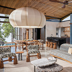 Origins Astral Lodge room with dining, couch, and kitchen