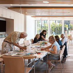 A group of people sitting around a table.