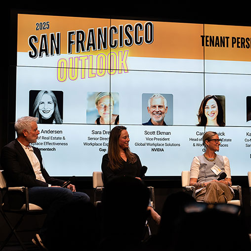 A group of people sitting on a stage.