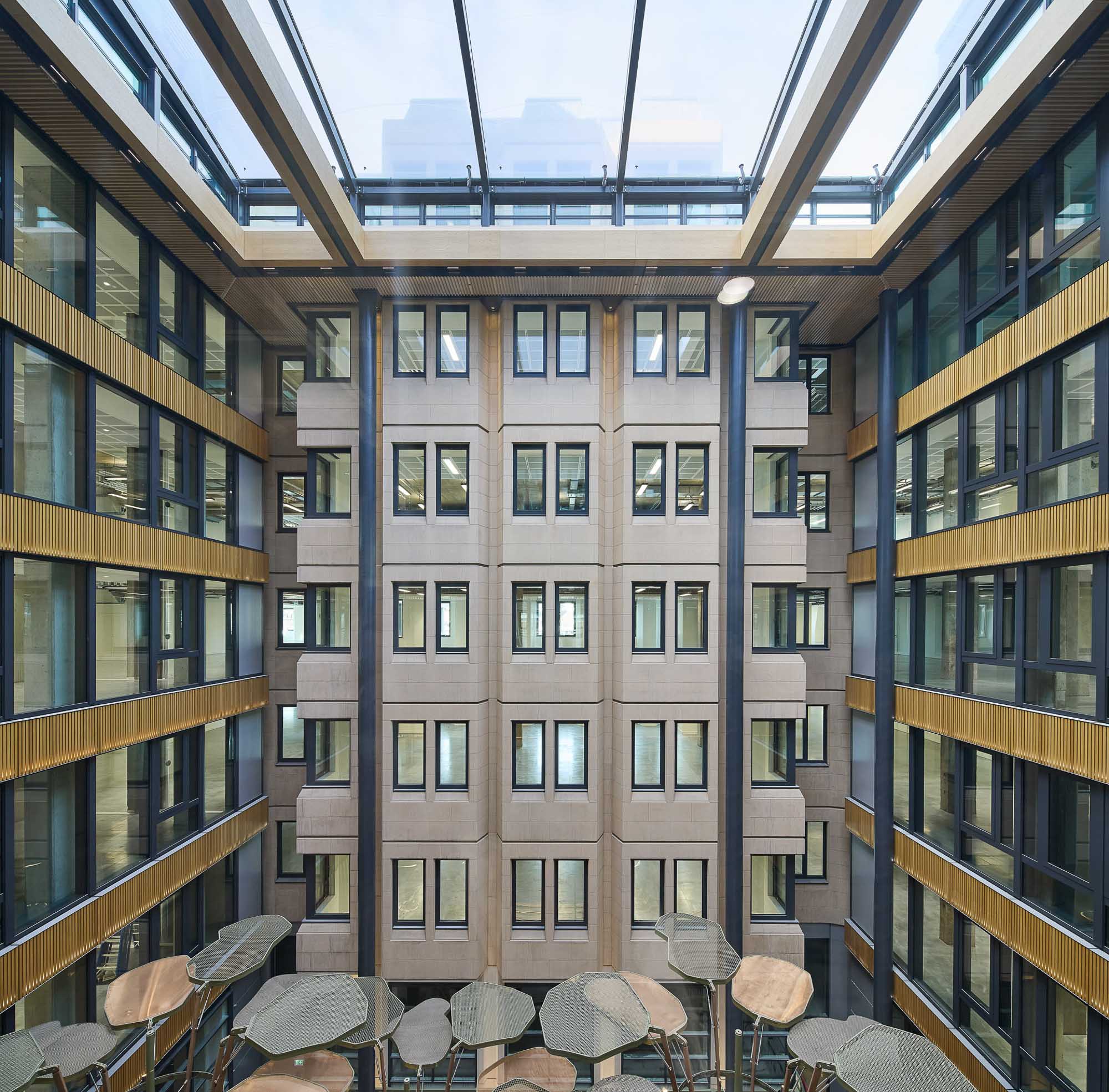 The Acre building interior with many windows