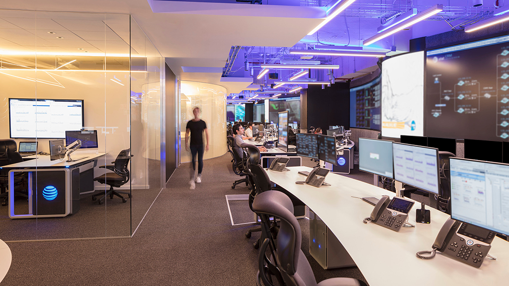 A room with computers and people.