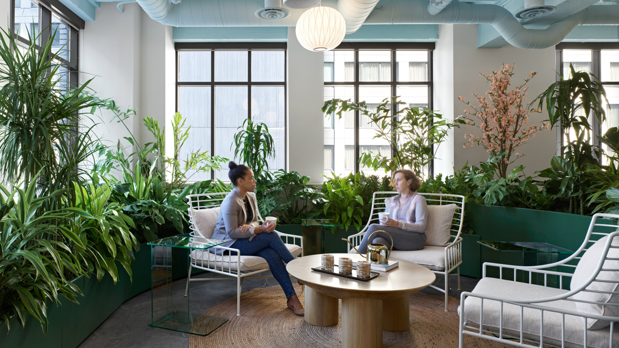 A couple of women sitting in chairs.