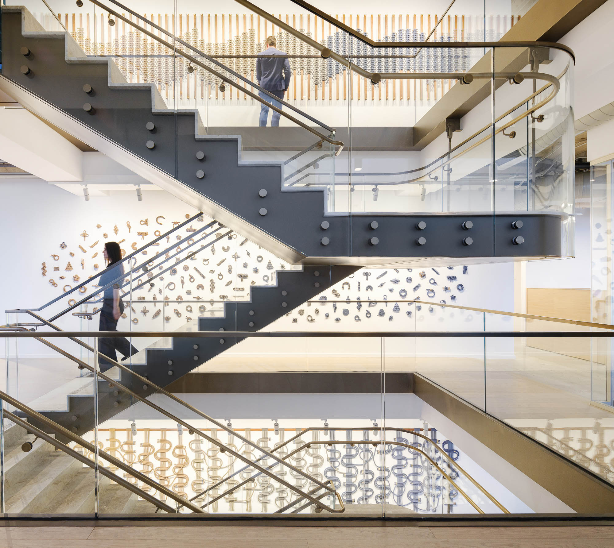 People walking up a staircase.