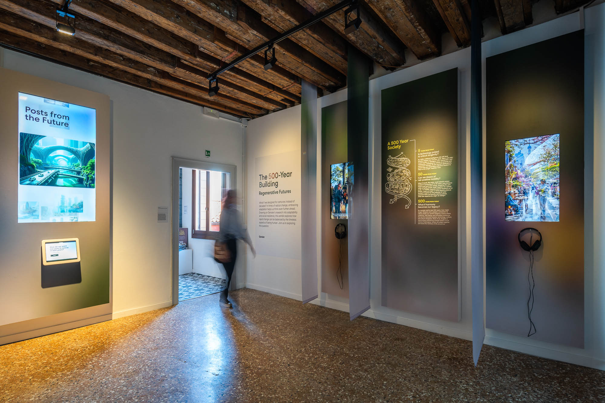 A person walking through Gensler's The 500-Year Building immersive installation