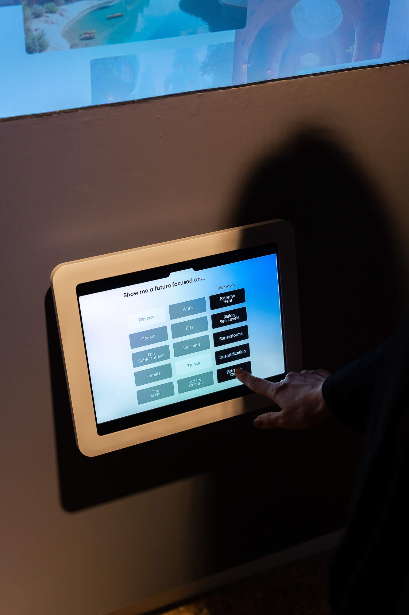 A person pointing at a screen.