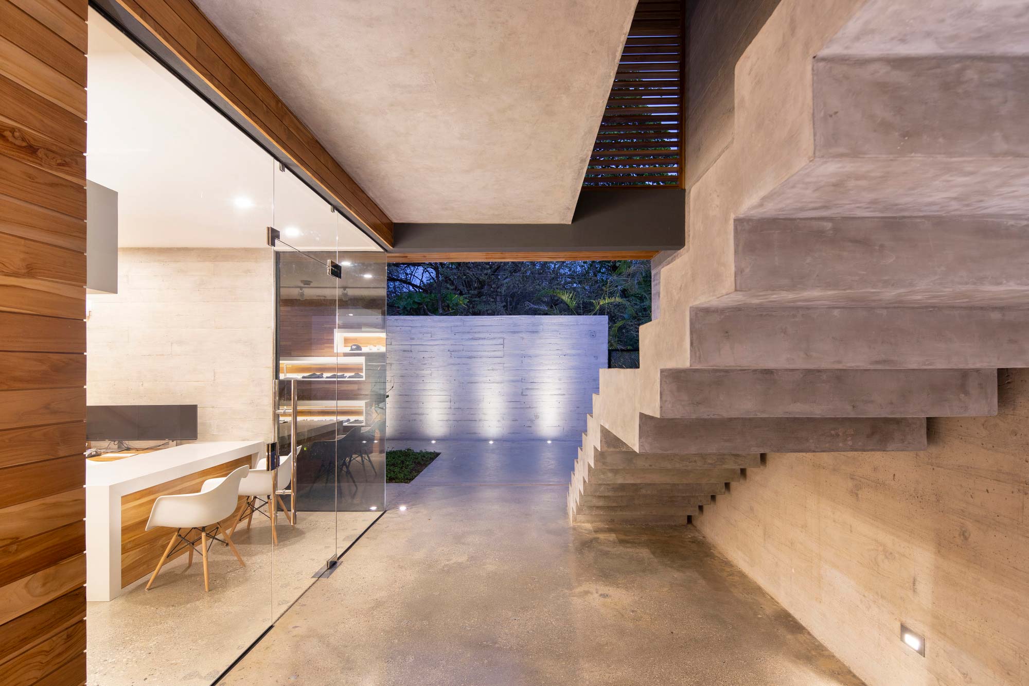 A room with a table and chairs.