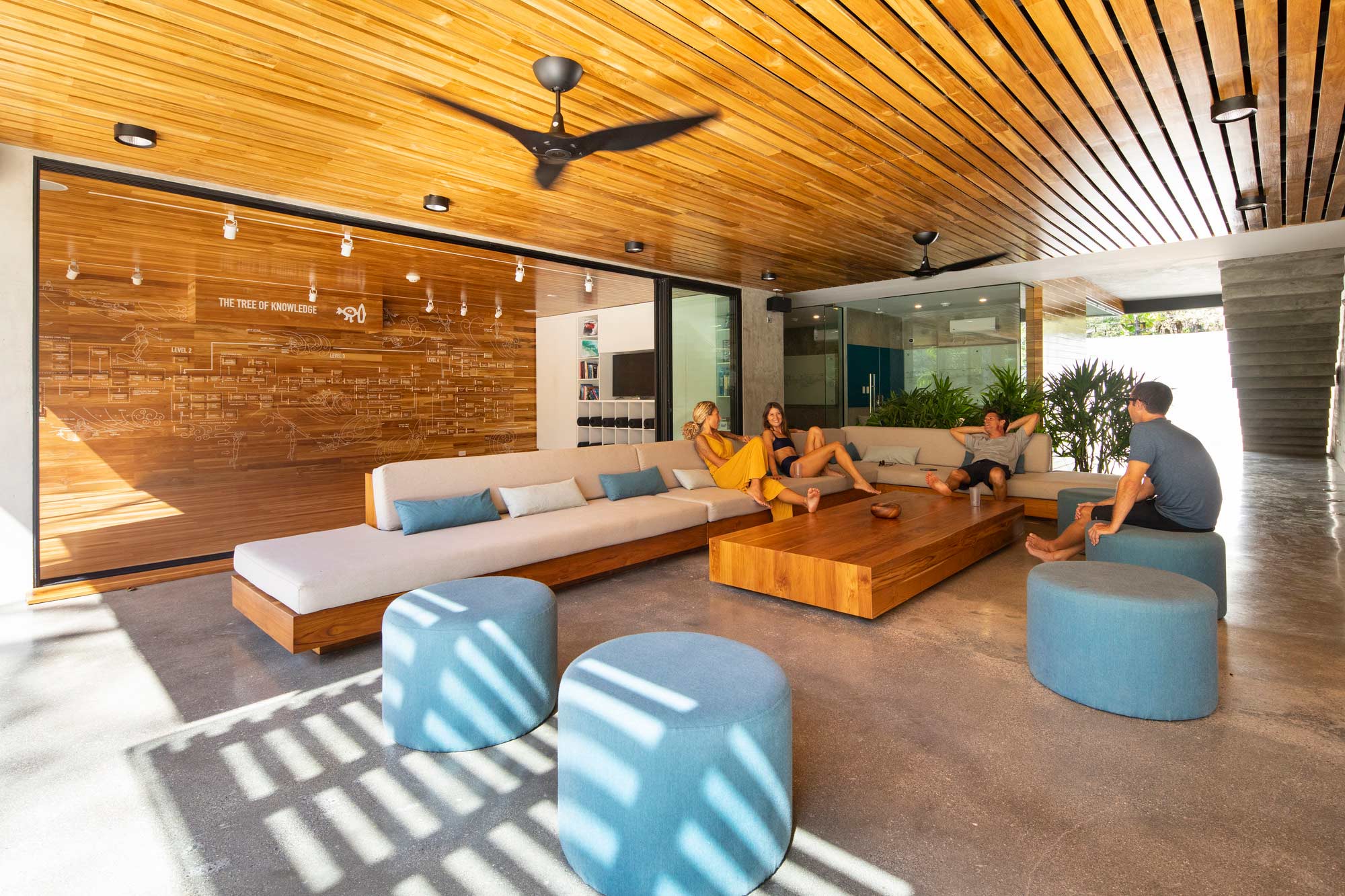 A group of people sitting in a living room.