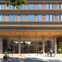 A building with a walkway and people walking around.