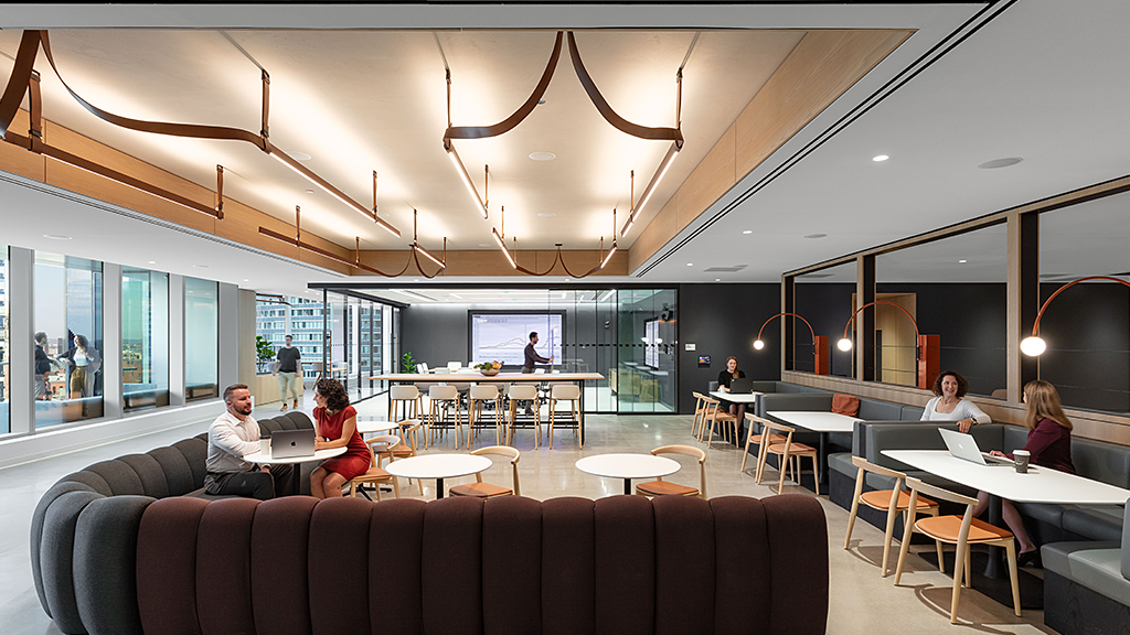 People sitting at tables in a room.
