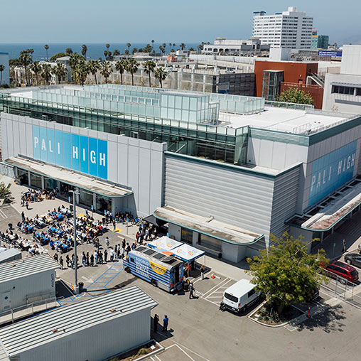 A large group of people outside a building.