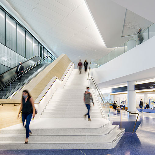 People walking down a flight of stairs.