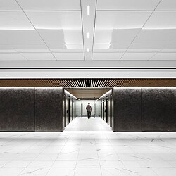 A person walking in a hallway.