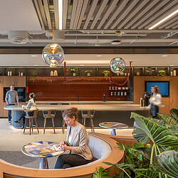 Financial services workplace interior with varied seating and plants