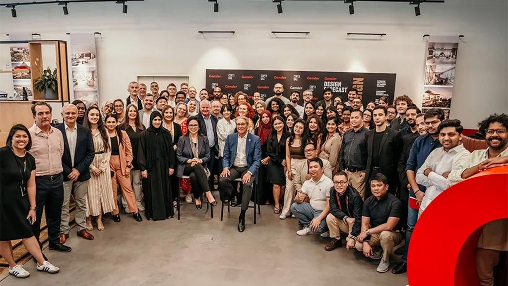 A group of people posing for a photo at the UAP Dubai Design Awards.