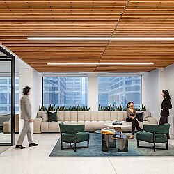 A group of people in the lounge area of the Attorneys' Liability Assurance Society office.