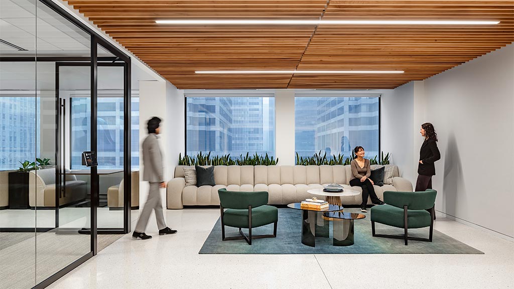 A group of people in the lounge area of the Attorneys' Liability Assurance Society office.