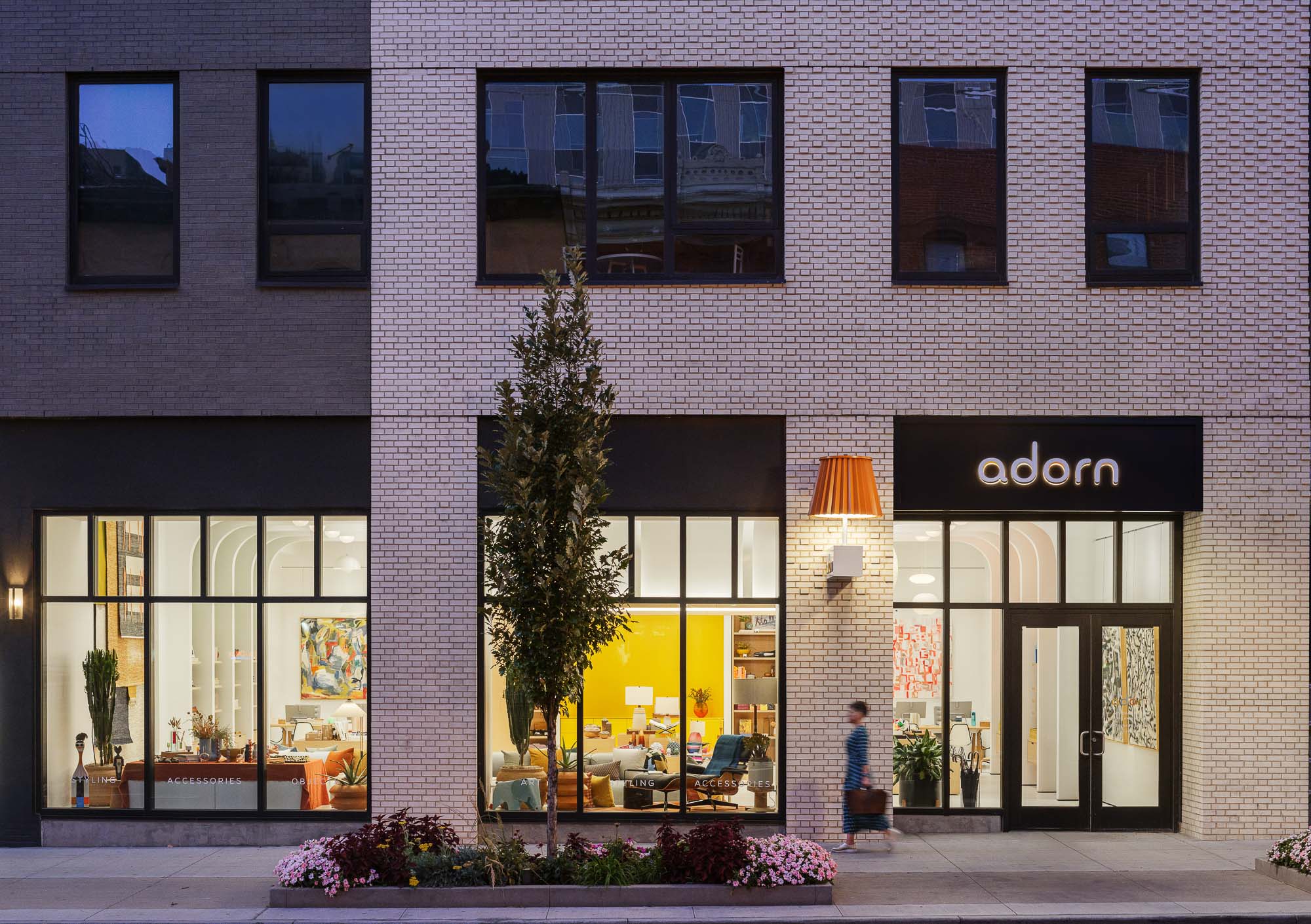 Adorn retail storefront in the evening