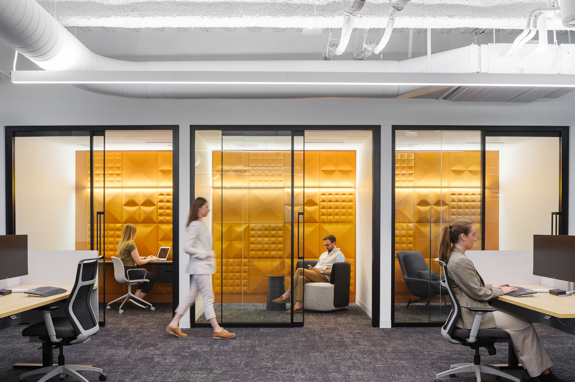 Crusoe Energy meeting rooms with yellow textured walls