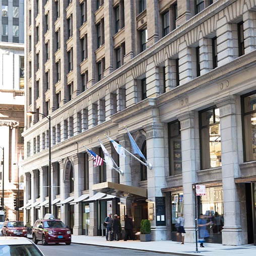 Kimpton Gray Hotel building in a bustling landmark area.
