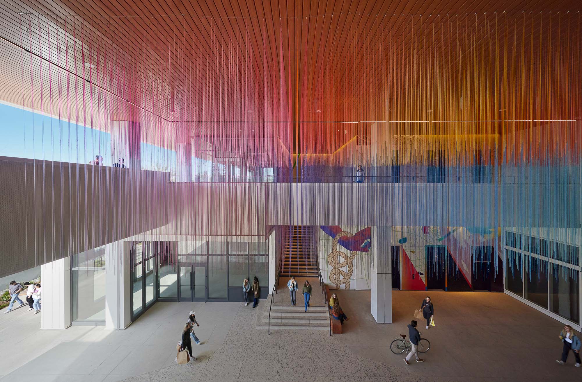 People walking in a large building.