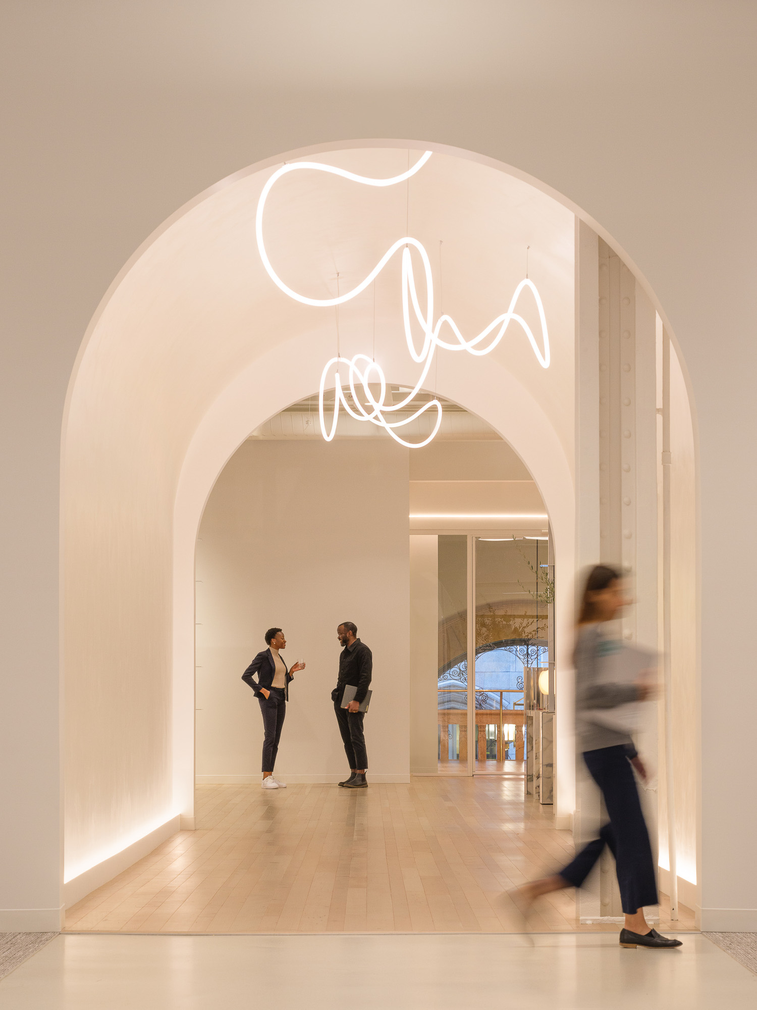 A group of people in a hallway.