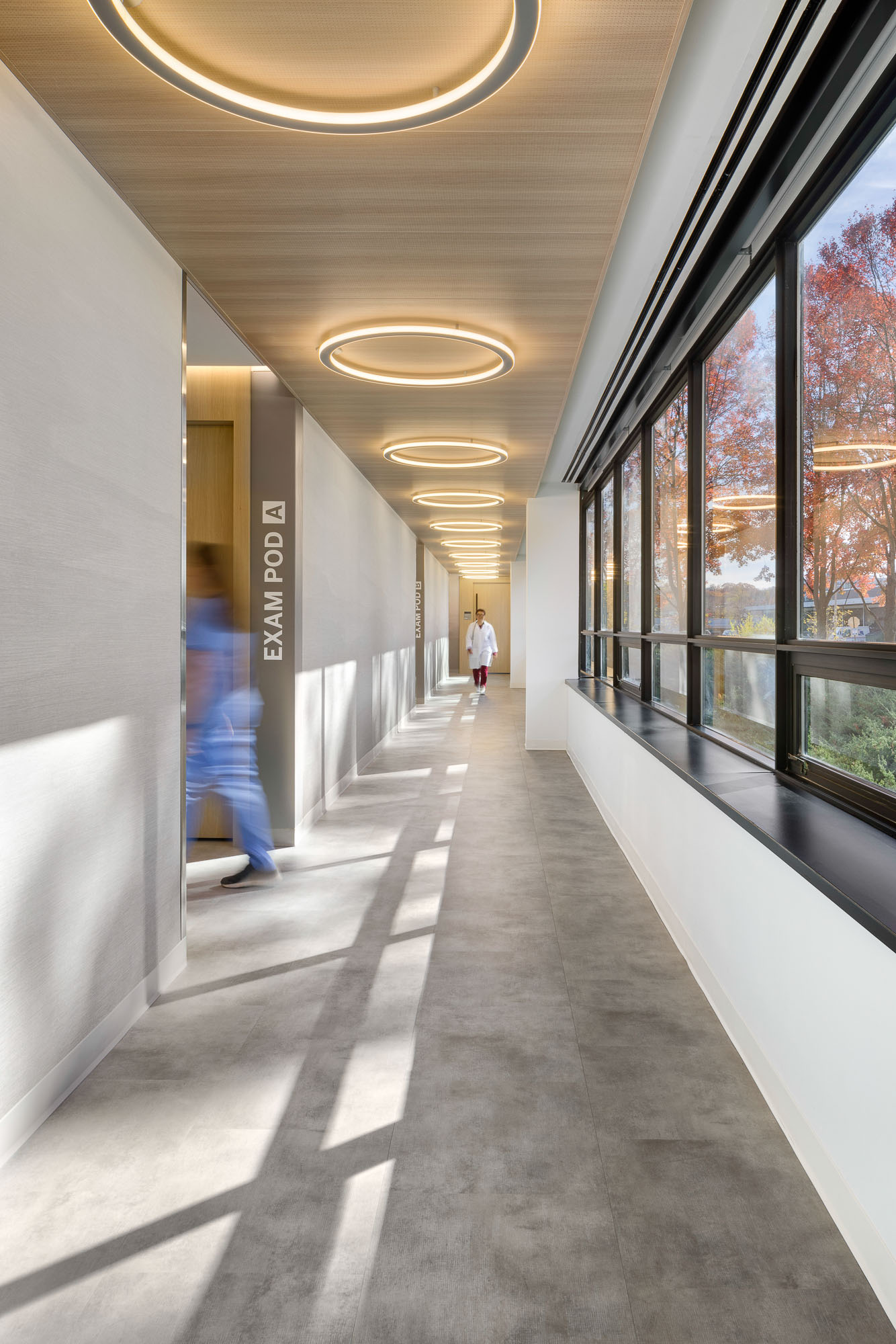 A person walking down a hallway.
