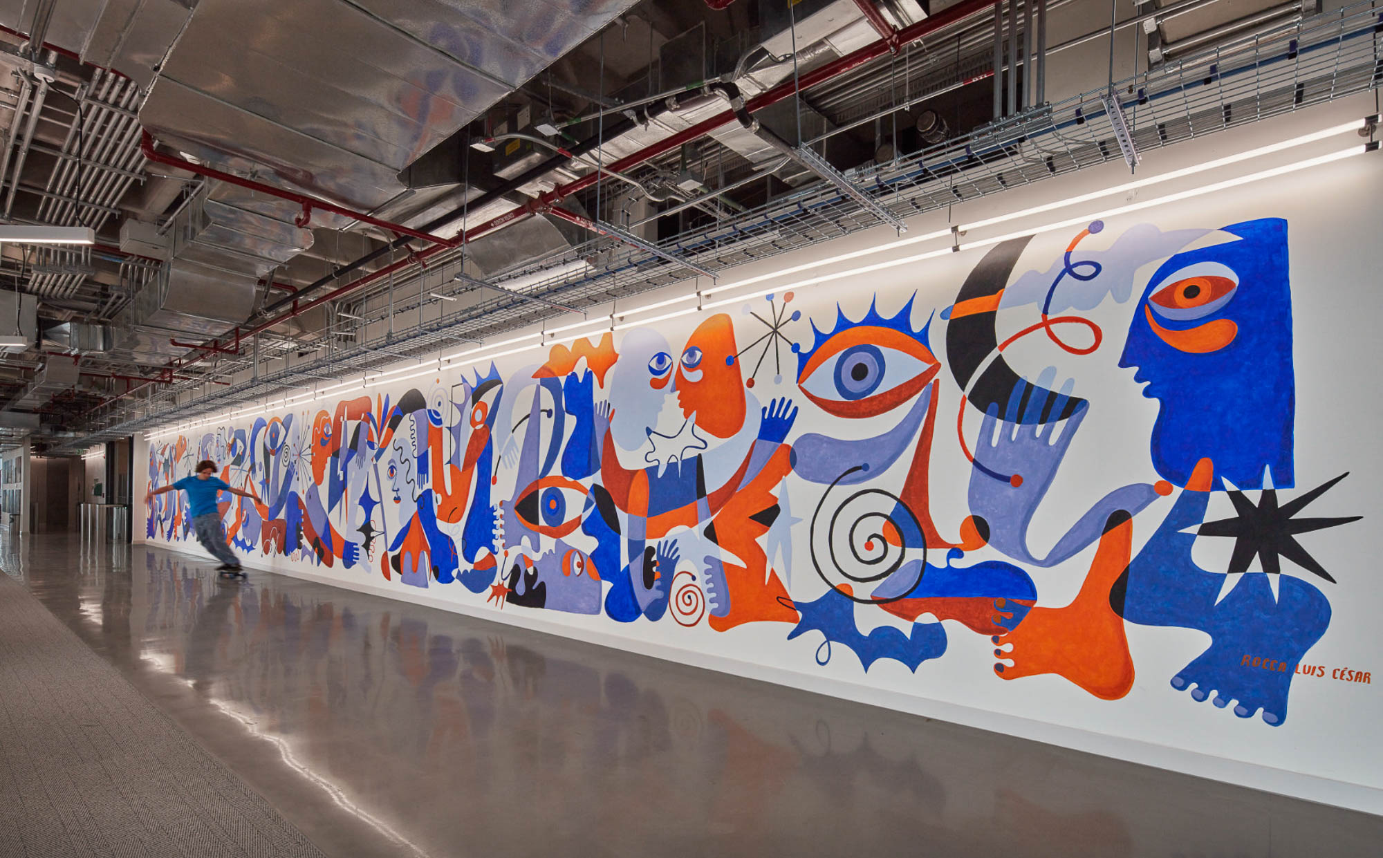 A wall with a mural of a cartoon character on it.