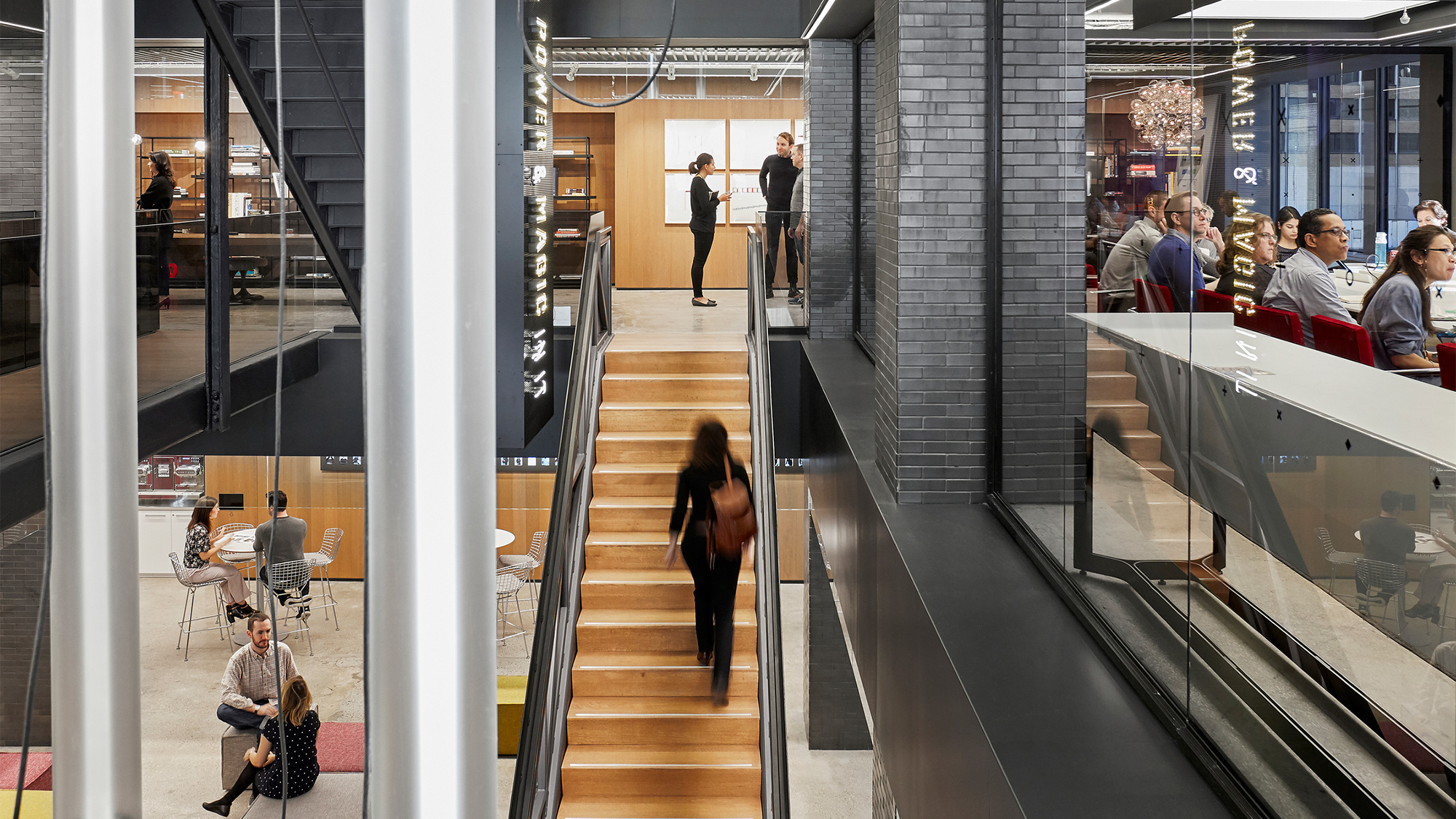 People walking down a flight of stairs.