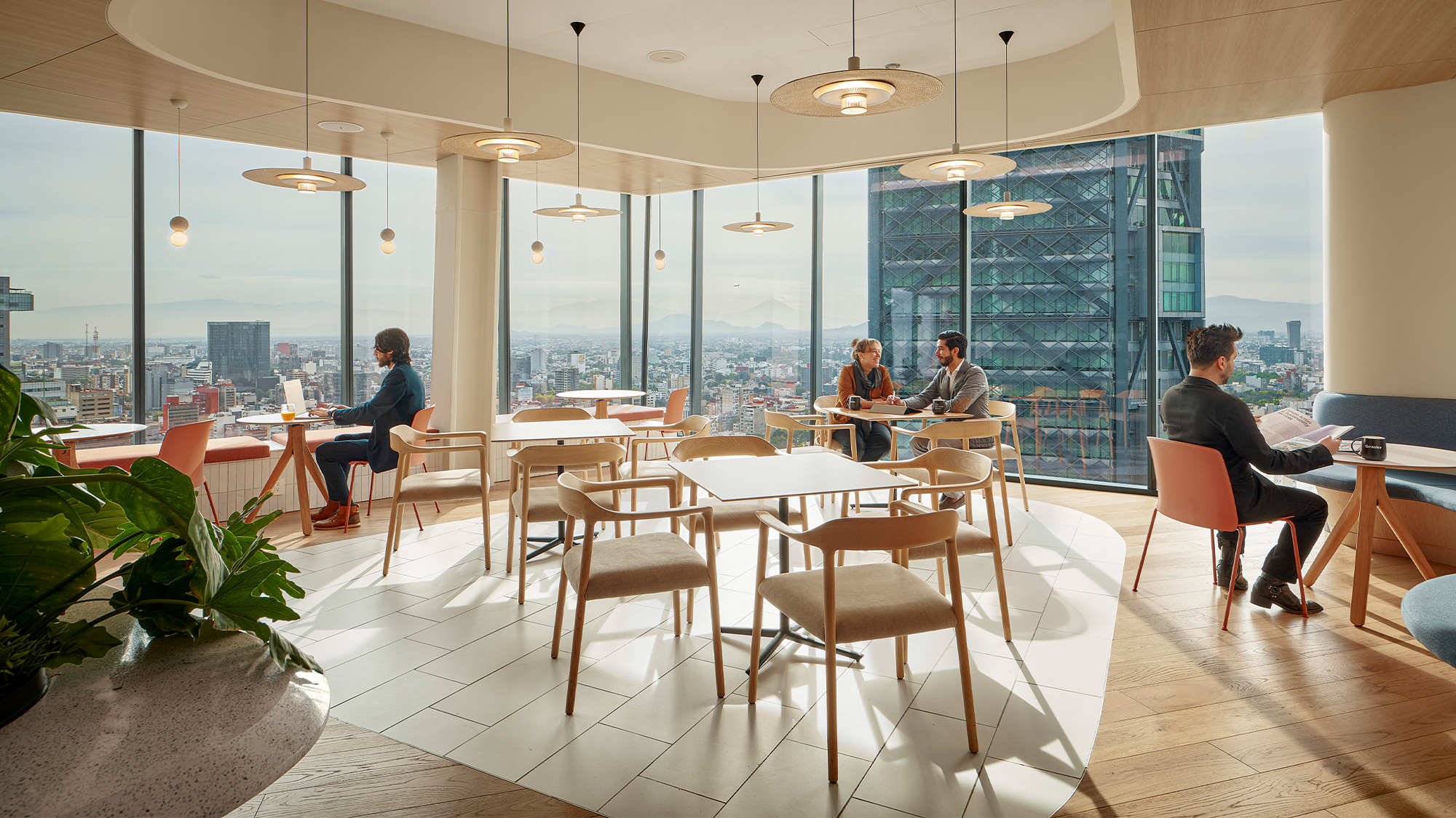 A group of people sitting at tables.