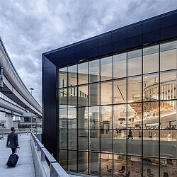A person walking on a bridge.