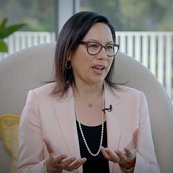 A woman wearing glasses.